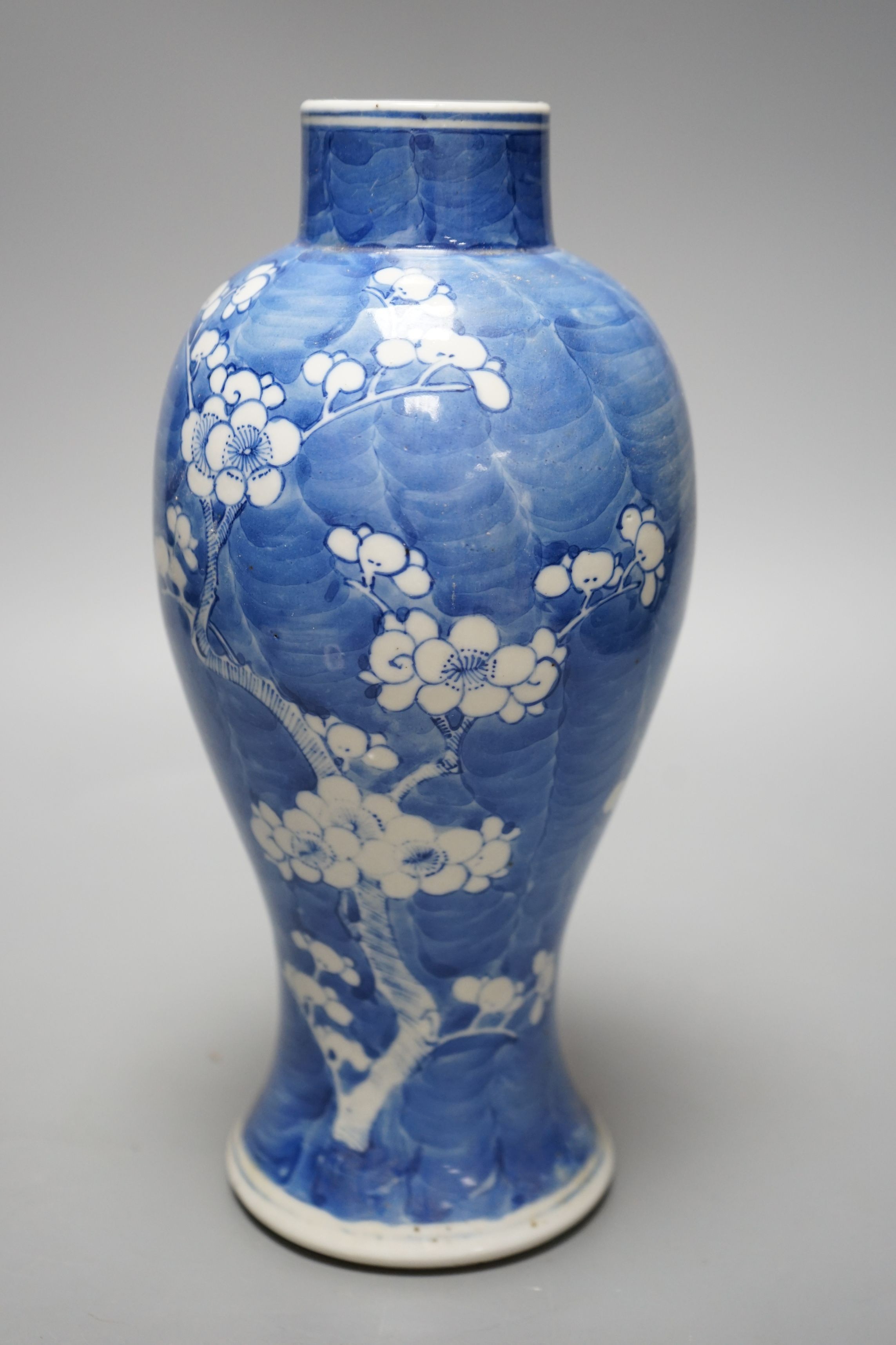 A late 19th century Chinese blue and white ‘prunus’ vase, 25cms high